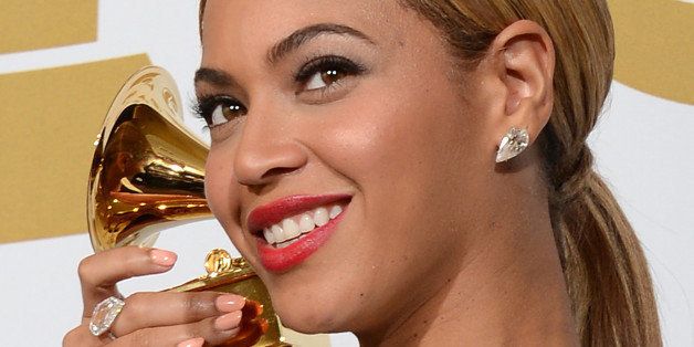 Singer Beyonce poses in the press room at the Staples Center during the 55th Grammy Awards in Los Angeles, California, February 10, 2013. AFP PHOTO Robyn BECK (Photo credit should read ROBYN BECK/AFP/Getty Images)
