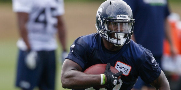 RENTON, WA - MAY 11: Running back Derrick Coleman #40 of the Seattle Seahawks rushes during Rookie Camp at the Virginia Mason Athletic Center on May 11, 2013 in Renton, Washington. (Photo by Otto Greule Jr/Getty Images)