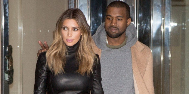 PARIS, FRANCE - JANUARY 19: Kim Kardashian and Kanye West are seen on January 19, 2014 in Paris, France. (Photo by Marc Piasecki/Getty Images)