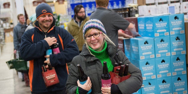 CHICAGO, IL - NOVEMBER 29: Nationwide on Black Friday, Chicago's Goose Island Beer Company released limited quantities of their award-winning Bourbon County Brand barrel-aged beers ---- Bourbon County Brand Stout, Bourbon County Brand Coffee Stout, Bourbon County Brand Barleywine and Backyard Rye Bourbon County Brand Stout. Here, hundreds of craft beer lovers purchase (and sample) Goose Island Bourbon County Brand Stout. Doors opened at 9 a.m. but hundreds flocked hours prior, at Binny's on November 29, 2013 in Chicago, Illinois. (Photo by Daniel Boczarski/Getty Images for Goose Island)