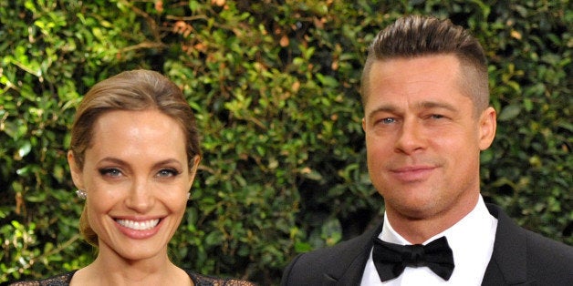 Angelina Jolie and Brad Pitt attend the 2013 Board of Governors of the Academy of Motion Picture Arts and Sciences' Governor Awards, on Saturday, Nov. 16, 2013 in Los Angeles (Photo by John Shearer/Invision/AP)