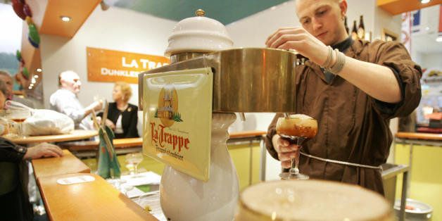 BERLIN, Germany: A vendor, dressed as a monk, serves Dutch 'Trappist' beer at the International 'Gruene Woche' agricultural trade fair in Berlin 17 January 2006. Trappist beer is traditionally made by trappist monks. AFP PHOTO JOHN MACDOUGALL (Photo credit should read JOHN MACDOUGALL/AFP/Getty Images)