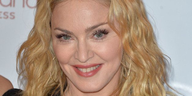 TORONTO, ON - FEBRUARY 11: Madonna arrives at the Hard Candy Fitness Toronto Grand Opening celebration on February 11th, 2014 in Toronto, Canada. (Photo by George Pimentel/WireImage)