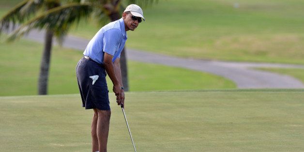 US President Barack Obama plays golf at Mid-Pacific Country Club in Kailua, Hawaii, 23, 2013. The first family is in Hawaii for their annual holiday vacation. AFP PHOTO/Jewel SAMAD (Photo credit should read JEWEL SAMAD/AFP/Getty Images)