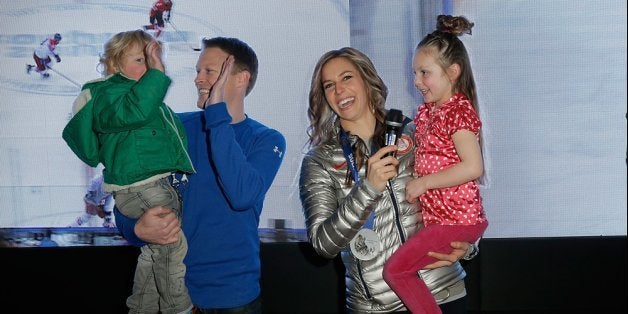 SOCHI, RUSSIA - FEBRUARY 15: U.S. Olympian Noelle Pikus-Pace (in silver) with family (L-R) Traycen Pace, Janson Pace and Lacee Pace visit the USA House in the Olympic Village on February 15, 2014 in Sochi, Russia. (Photo by Joe Scarnici/Getty Images for USOC)