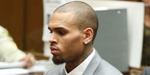 LOS ANGELES, CA - FEBRUARY 28: Recording artist Chris Brown appears in Los Angeles Superior Court on February 28, 2014 in Los Angeles, California. Brown has been on probation since pleading guilty to assaulting his then girlfriend, singer Rihanna, after a pre-Grammy Awards party in 2009. He has been in anger management treatment program and performing community service requirements. Brown and his bodyguard Christopher Hollosy are also facing misdemeanor simple assault charges after from an incident outside the W hotel in Washington D.C. last October. (Photo by Frederick M. Brown/Getty Images)