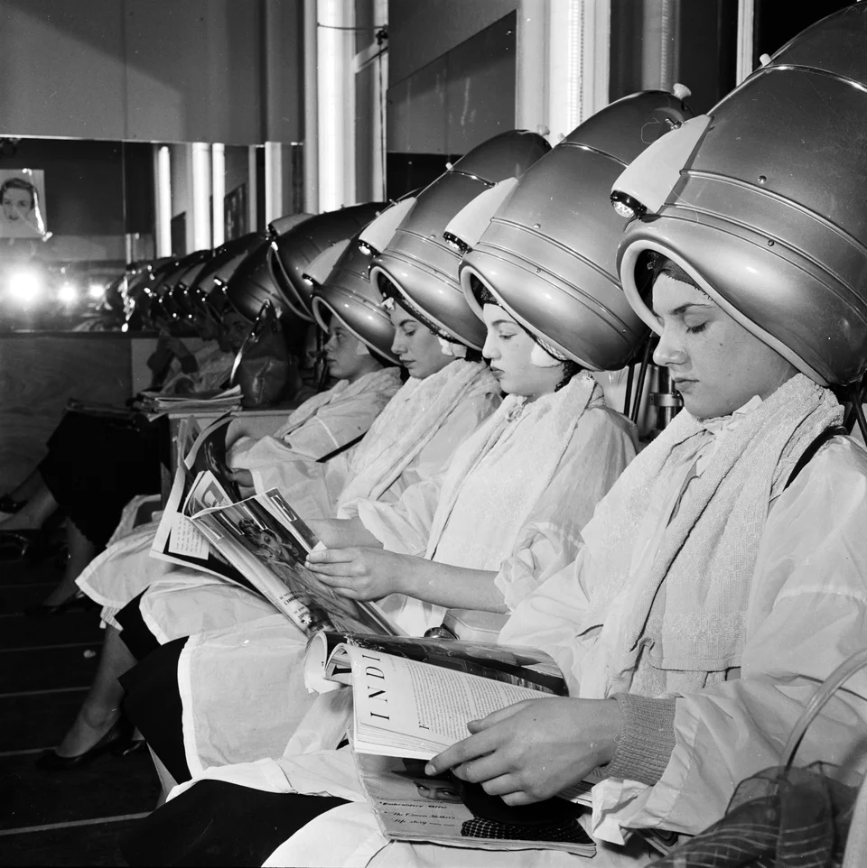 Women Sitting Under Hair Dryers By Bettmann