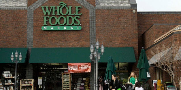 In this photo taken Sunday, Feb. 6, 2011, customers gather outside of a Little Rock, Ark., Whole Foods store. Whole Foods Market Inc. releases quarterly financial earnings Wednesday, Feb. 9, after the market close.(AP Photo/Danny Johnston)