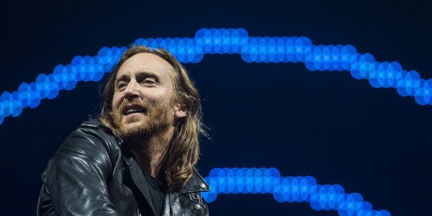 French DJ David Guetta performs on the opening day of the Rock in Rio music festival, in Rio de Janeiro, Brazil, on September 13, 2013. AFP PHOTO / YASUYOSHI CHIBA (Photo credit should read YASUYOSHI CHIBA/AFP/Getty Images)