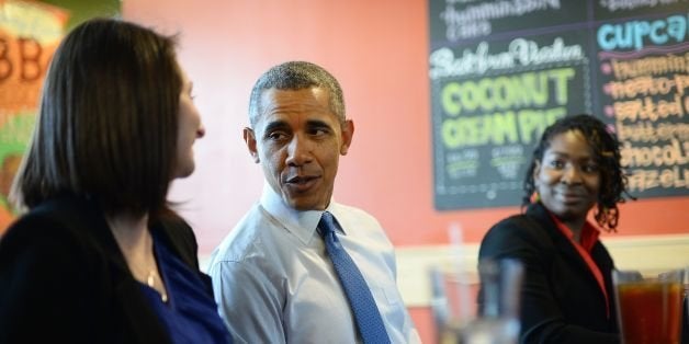 US President Barack Obama has lunch with restaurant workers at Zingerman's on April 2, 2014 in Ann Arbor, Michigan. Obama arrived in Michigan to speak on raising the national minimum wage. Obama unveiled a proposal to increase the federal minimum wage from $7.25 to $10.10 (7.35 euros) an hour in his State of the Union address in January as he set about closing income disparity -- an increasingly important theme in US politics. AFP PHOTO/Jewel Samad (Photo credit should read JEWEL SAMAD/AFP/Getty Images)