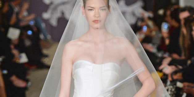 NEW YORK, NY - APRIL 11: A model walks the runway during the Carolina Herrera Spring 2015 Bridal collection show at on April 11, 2014 in New York City. (Photo by Mike Coppola/Getty Images)