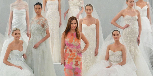 NEW YORK, NY - APRIL 11: Designer Monique L'huillier poses with models during the Monique Lhuillier Spring 2015 Bridal collection show on April 11, 2014 in New York City. (Photo by Slaven Vlasic/Getty Images)