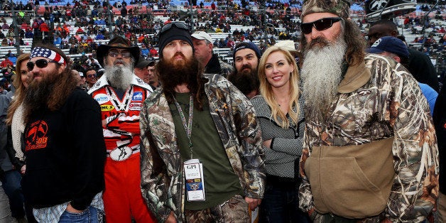 FORT WORTH, TX - APRIL 06: (L-R) Willie, Si, Jase, Jessica and Phil Robertson take part in pre-race ceremonies for the NASCAR Sprint Cup Series Duck Commander 500 at Texas Motor Speedway on April 6, 2014 in Fort Worth, Texas. (Photo by Sean Gardner/NASCAR via Getty Images)