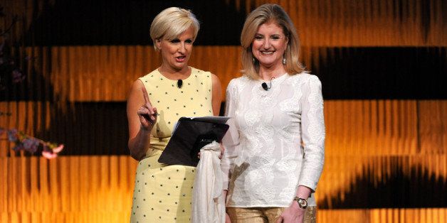 NEW YORK, NY - APRIL 24: (EXCLUSIVE COVERAGE) Arianna Huffington (R) and Mika Brzezinski speak on stage during THRIVE: A Third Metric Live Event at New York City Center on April 24, 2014 in New York City. (Photo by D Dipasupil/Getty Images)