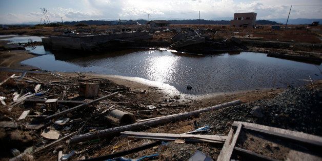 Debris litters an area damaged by the March 2011 earthquake and tsunami in Namie, Fukushima Prefecture, Japan, on Monday, March 10, 2014. March 11 marks three years since Japan's deadliest earthquake in 2011, a magnitude-9 temblor that triggered a tsunami in northeastern Japan, leaving about 19,000 people dead or missing and hundreds of thousands homeless as it wiped out entire towns. Photographer: Kiyoshi Ota/Bloomberg via Getty Images