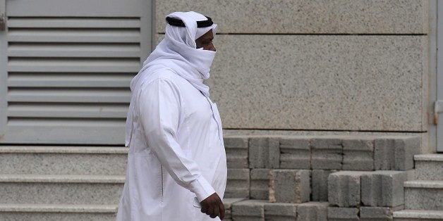 A Saudi man covers his mouth and nose while he walks down a main street in the Saudi capital on April 29, 2014 as the death toll from the newly emerged and often fatal Middle East Respiratory Syndrome (MERS) disease topped 100 in the desert kingdom. The health ministry reported more MERS cases in the city of Jeddah, prompting authorities to close the emergency department at the city's King Fahd Hospital. AFP PHOTO/FAYEZ NURELDINE (Photo credit should read FAYEZ NURELDINE/AFP/Getty Images)