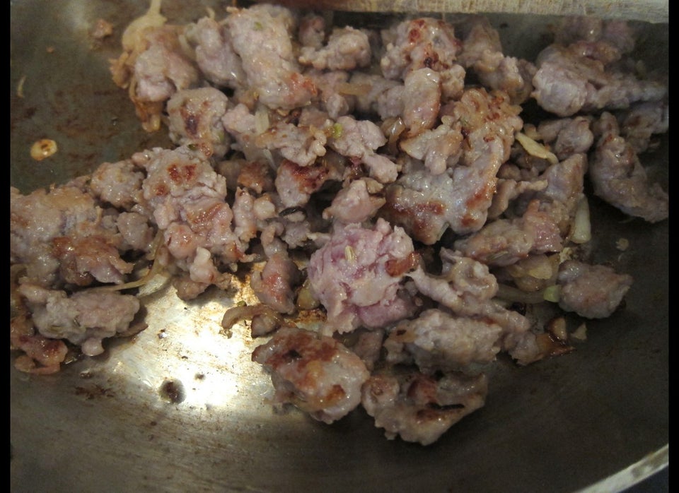 Browning Italian sausage meat with a little onion and a little garlic