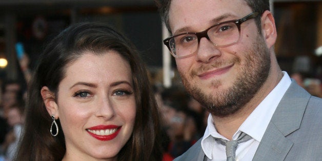 WESTWOOD, CA - APRIL 28: Actor Seth Rogen (R) and wife Lauren Miller attend the premiere of Universal Pictures' 'Neighbors' at Regency Village Theatre on April 28, 2014 in Westwood, California. (Photo by David Livingston/Getty Images)