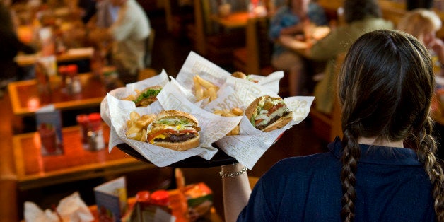 GERMANTOWN, MD - JULY 6: The menus at Red Robin lists the calories for each item as required by Montgomery County. Charlsie Sienkwicz delievers burgers and fries to a large party at lunchtime Wednesday, July 6, 2011 in Germantown, MD. .Photo by Katherine Frey/The Washington Post via Getty Images)