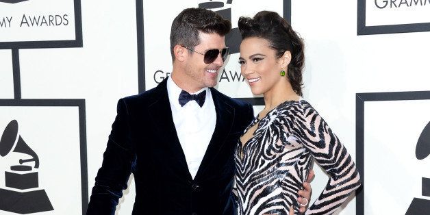 LOS ANGELES, CA - JANUARY 26: Singer Robin Thicke (L) and actress Paula Patton attends the 56th GRAMMY Awards at Staples Center on January 26, 2014 in Los Angeles, California. (Photo by Jason Merritt/Getty Images)