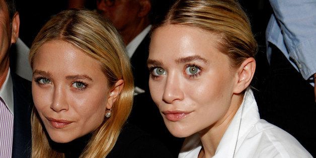 NEW YORK, NY - SEPTEMBER 14: Actresses Mary-Kate Olsen and Ashley Olsen pose at FIJI Water at the J. Mendel Spring 2012 show during Mercedes-Benz Fashion Week on September 14, 2011 in New York City. (Photo by Amy Sussman/Getty Images for FIJI Water)