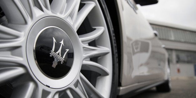 The logo of Italian luxury car manufacturer Maserati is seen on the front wheel of a Maserati Quattroporte outside a Maserati plant on May 22, 2014 in Grugliasco, near Turin. The plant was renamed after late Italian President of carmaker Fiat, Gianni Agnelli. AFP PHOTO / MARCO BERTORELLO (Photo credit should read MARCO BERTORELLO/AFP/Getty Images)