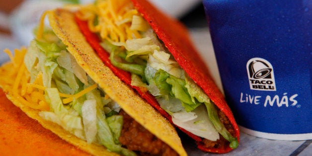 Doritos Locos tacos and a fountain drink are arranged for a photograph at a Taco Bell restaurant, a unit of Yum! Brands Inc., in Redondo Beach, California, U.S., on Friday, Oct. 4, 2013. Yum! Brands Inc. is scheduled to release earnings data on Oct. 8. Photographer: Patrick T. Fallon/Bloomberg via Getty Images