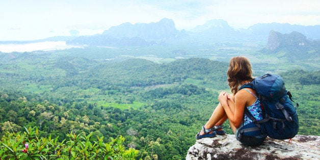 young backpacker sitting on a...