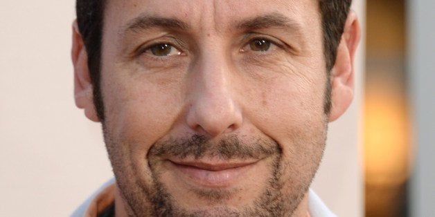 Actor Adam Sandler arrives for the red carpet premiere of 'Blended,' May 21, 2014 at TCL Chinese Theatre in Hollywood, California. AFP PHOTO / ROBYN BECK (Photo credit should read ROBYN BECK/AFP/Getty Images)