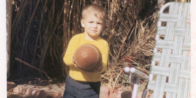 In San Diego, my grandparent's place (dad's side). I gots me a football. I have good memories of that place. The plants there grew so tall at the edge of the yard that it was like a natural fence. This is around 1970 or 1971.