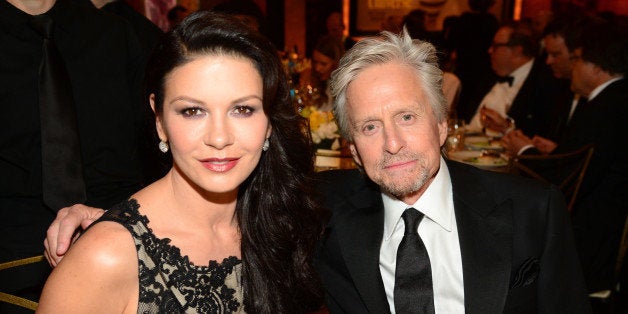 HOLLYWOOD, CA - JUNE 05: Actors Catherine Zeta-Jones (L) and Michael Douglas attend the 2014 AFI Life Achievement Award: A Tribute to Jane Fonda at the Dolby Theatre on June 5, 2014 in Hollywood, California. Tribute show airing Saturday, June 14, 2014 at 9pm ET/PT on TNT. (Photo by Frazer Harrison/Getty Images for AFI)