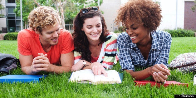 group of happy college students ...