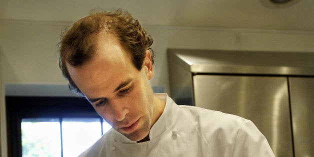 POCANTICO HILLS, UNITED STATES: TO GO WITH STORY BY CATHERINE HOURS: Dan Barber, head chef at Blue Hill at Stone Barns restaurant, prepares a dish 12 May, 2005, at Stone Barns Center for Food and Agriculture on the Rockefeller family estate in Pocantico Hills, New York, about 30 miles (50 km) north of Manhattan. The Center is a non-profit farm, educational center and restaurant that demonstrates and promotes sustainable, community-based food production. Crops and animals raised on the farm are used at the Blue Hill restaurant on the premises. AFP PHOTO/Stan HONDA (Photo credit should read STAN HONDA/AFP/Getty Images)