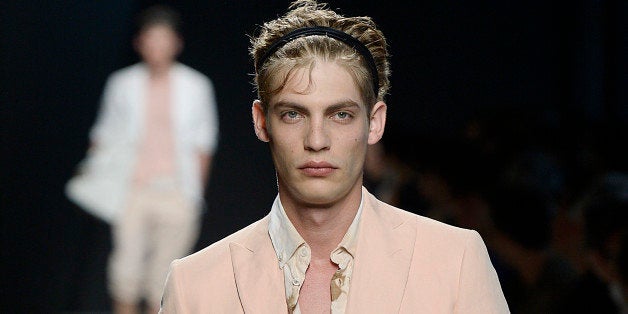 MILAN, ITALY - JUNE 22: A model walks the runway at the Bottega Veneta Spring Summer 2015 fashion show during Milan Menswear