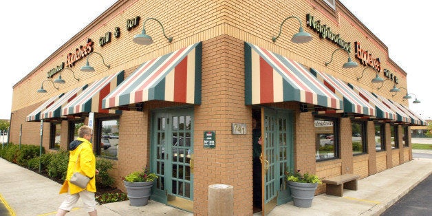 PALATINE, IL - MAY 18: A customer walks towards an entrance to an Applebee's restaurant May 18, 2004 in Palatine, Illinois. Applebee's has introduced new Weight Watchers items on its menu. (Photo by Tim Boyle/Getty Images)