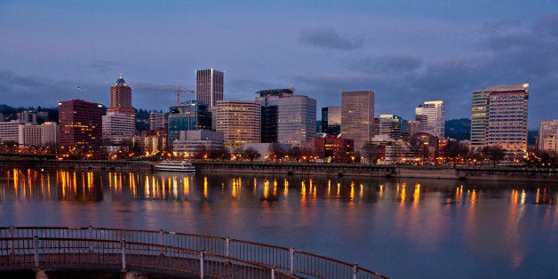 PORTLAND, OR - FEBRUARY 11: The downtown skyline and an Eastbank Esplanade walkway are viewed in the early morning on Februa