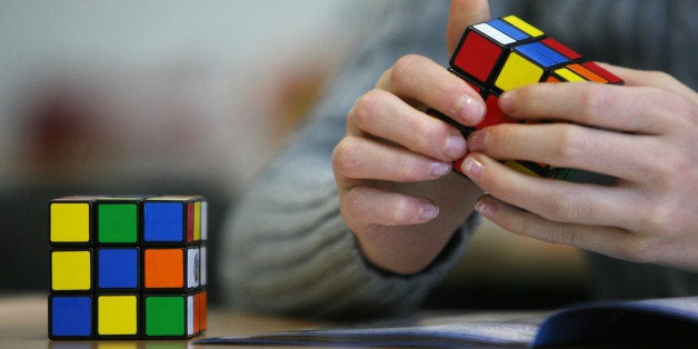 A seventh grade student of the 'Free Christian' school in Duesseldorf trys out the Rubik's Cube for the first time on November 9, 2010. Starting in January 2011 schools can decide to use the Rubik's Cube to develop their children's spatial thinking and imagination. AFP PHOTO / PATRIK STOLLARZ (Photo credit should read PATRIK STOLLARZ/AFP/Getty Images)