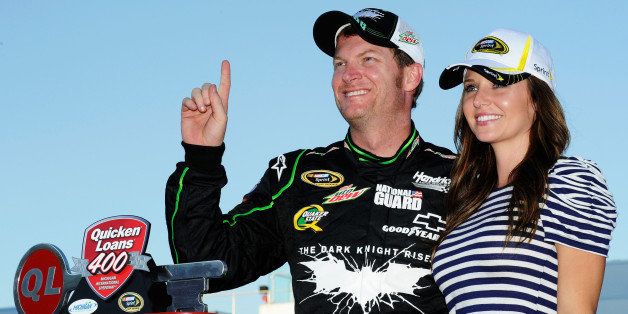 BROOKLYN, MI - JUNE 17: Dale Earnhardt Jr., driver of the #88 Diet Mountain Dew/TheDarkKnightRises/National Guard/ Chevrolet, celebrates in Victory Lane with girlfriend, Amy Reimann after winning the NASCAR Sprint Cup Series Quicken Loans 400 at Michigan International Speedway on June 17, 2012 in Brooklyn, Michigan. (Photo by John Harrelson/Getty Images for NASCAR)