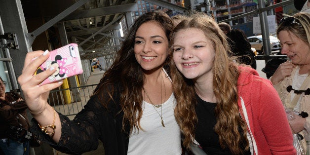 NEW YORK, NY - APRIL 23: Bethany Mota (L) poses with a fan at Unleash YouTube Event with stars Michelle Phan, Rosanna Pansino And Bethany Mota on April 23, 2014 in New York City. (Photo by Dimitrios Kambouris/Getty Images for YouTube)