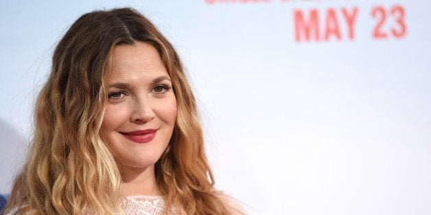 Actress Drew Barrymore arrives for the red carpet premiere of 'Blended,' May 21, 2014 at TCL Chinese Theatre in Hollywood, California. AFP PHOTO / ROBYN BECK (Photo credit should read ROBYN BECK/AFP/Getty Images)