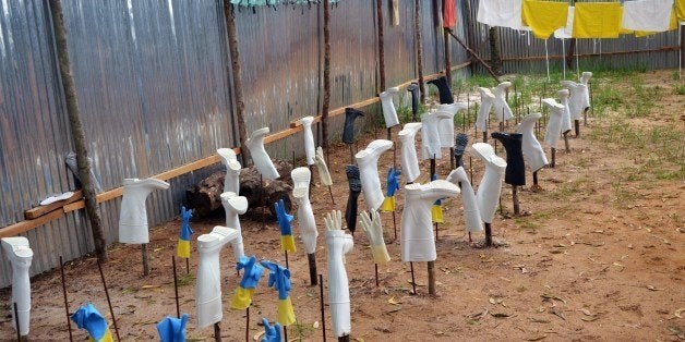 A picture taken on July 24, 2014 shows protective gear including boots, gloves, masks and suits, drying after being used in a treatment room in the ELWA hospital in the Liberian capital Monrovia. An American doctor battling West Africa's Ebola epidemic has himself fallen sick with the disease in Liberia, Christian charity Samaritan's Purse said on July 27. AFP PHOTO / ZOOM DOSSO (Photo credit should read ZOOM DOSSO/AFP/Getty Images)