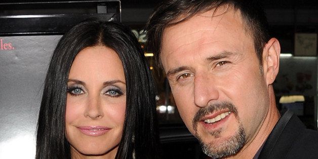 HOLLYWOOD, CA - APRIL 11: Actors Courteney Cox (L) and David Arquette arrive at the premiere of The Weinstein Company's 'Scream 4' Presented by AXE Shower held at Grauman's Chinese Theatre on April 11, 2011 in Hollywood, California. (Photo by Kevin Winter/Getty Images)