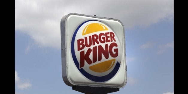 This Wednesday, June 20, 2012, photo shows a Burger King sign in Richardson, Texas. The world's No. 2 hamburger chain began trading as a public company again Wednesday under the ticker symbol ᅢ까タᅡワBKWᅢ까タᅡン for TKTKT a share. The Miami-based chain had last traded as a public company between 2006 and 2010, before it was purchased and taken private by investment firm 3G Capital. ( ( AP Photo/LM Otero)