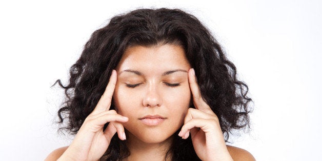 A girl is concentrating her mind while doing a meditation sessionWe welcome you to use any of our images, please credit our site  MeditationMusic.net as the original source if you do.