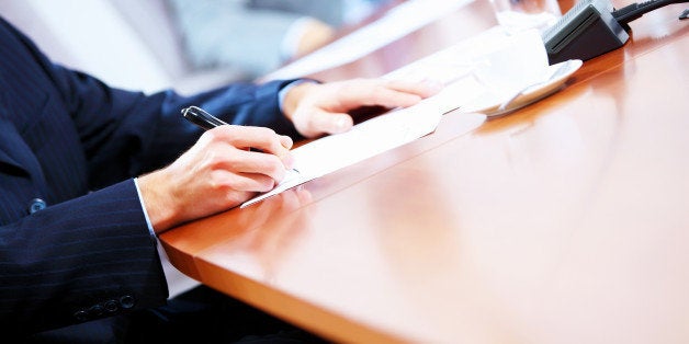 Image of a business work place with papers on the table