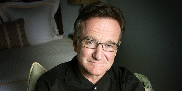 FILE - This June 15, 2007 file photo shows actor and comedian Robin Williams posing for a photo in Santa Monica, Calif. Williams, whose free-form comedy and adept impressions dazzled audiences for decades, died Monday, Aug. 11, 2014, in an apparent suicide. Williams was 63. (AP Photo/Reed Saxon, File)