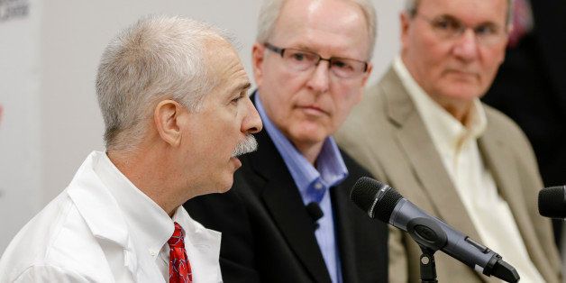 Dr. Mark Rupp, chief of the division of infectious diseases in the department of internal medicine at the Nebraska Medical Center, left, speaks as SIM USA President Bruce Johnson, center, and SIM Liberia country director Will Elphick, right, listen, at a news conference in Omaha, Neb., Friday Sept. 5, 2014, on the condition of ebola patient Dr. Rick Sacra, 51, who is treated at the center. Sacra, who served with North Carolina-based charity SIM, is the third American aid worker infected by the Ebola virus. He will begin treatment in the hospital's 10-bed special isolation unit, the largest of four such units in the U.S. (AP Photo/Nati Harnik)