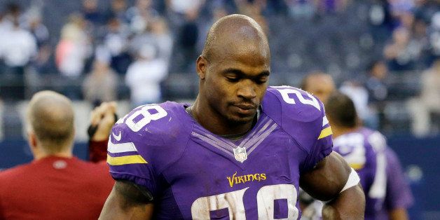 Minnesota Vikings' Adrian Peterson (28) walks off the field following their 27-23 loss to the Dallas Cowboys in an NFL football game, Sunday, Nov. 3, 2013, in Arlington, Texas. (AP Photo/Nam Y. Huh)