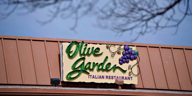 Darden Restaurants Inc. Olive Garden signage is displayed outside of a location in Peoria, Illinois, U.S., on Tuesday, March 18, 2014. Darden Restaurants Inc. is scheduled to release earnings figures on March 21. Photographer: Daniel Acker/Bloomberg via Getty Images