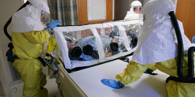 **FILE** In this file photo from Oct. 28, 2006, a mock patient is cared for in an isolation pod during a drill at the Nebraska biocontainment unit in the Nebraska Medical Center in Omaha, Neb. A missionary, Dr. Rick Sacra, 51, who was infected with Ebola while serving in Liberia is being flown to the Nebraska Medical Center in Omaha where he is expected to arrive Friday morning. Sacra will begin treatment in the hospital's special isolation unit, believed to be the largest in the U.S. (AP Photo/Nati Harnik)